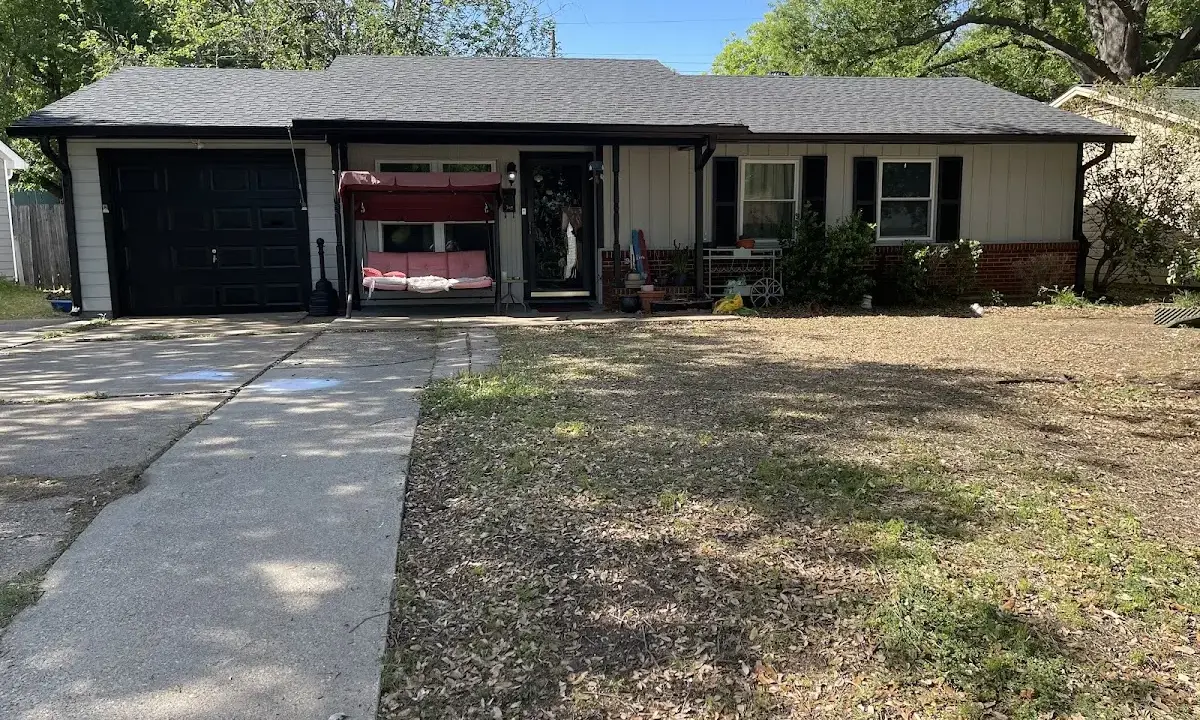 Asphalt Shingle Roof Repair crew at work on a residential roof in Gatesville